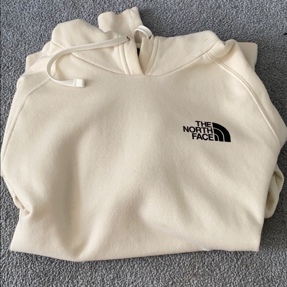 The north face cream colored sweatshirt